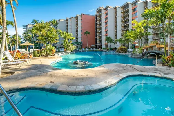 Resort-style pool with lounge chairs, just steps from the unit.