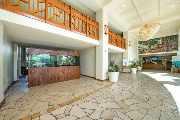 Covered lobby entrance with an open, airy island feel.