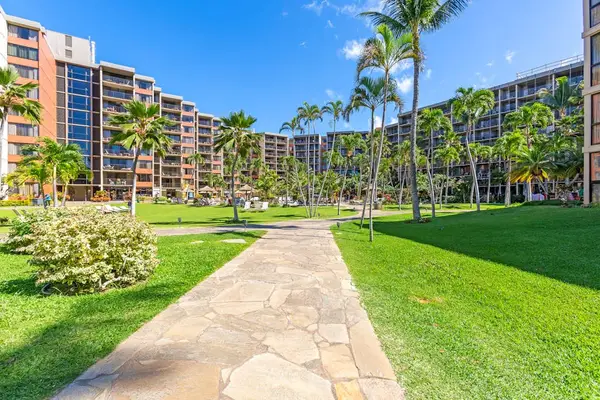 Landscaped walkway leading to the resort entrance.