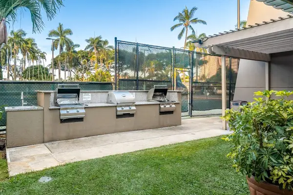 BBQ grill area with picnic seating, great for outdoor dining
