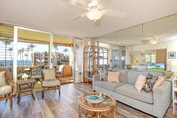 Lovely living room and sunlight streaming in from the sliding glass doors.