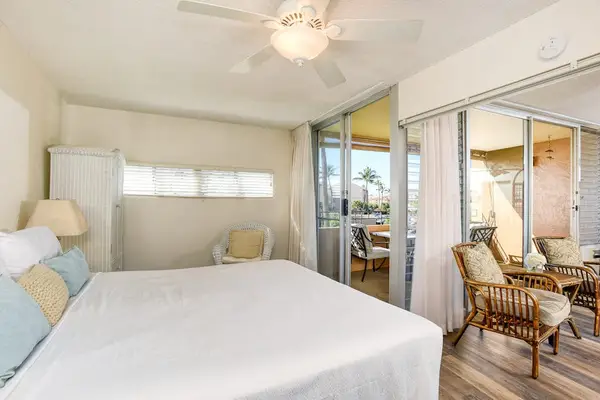 Master bedroom with king bed, flat screen tv and an ensuite bathroom.