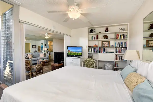 Master bedroom with king bed, flat screen tv and an ensuite bathroom.