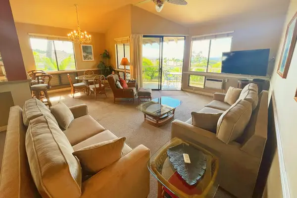 Open-Concept Living Room with Dual Sofas, Flat-Screen TV & Lanai Access