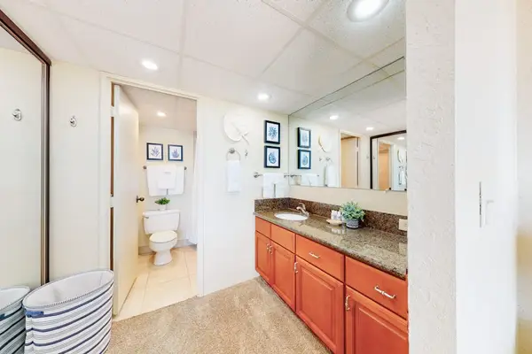 Primary bedroom spacious bathroom with a walk-in shower and plenty of storage for your toiletries.