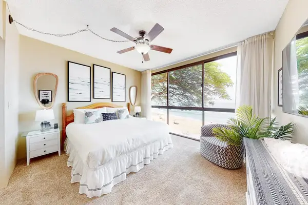 Primary bedroom with a king bed and plenty of natural light.