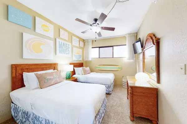 Guest bedroom with two comfortable beds, ideal for family or friends.