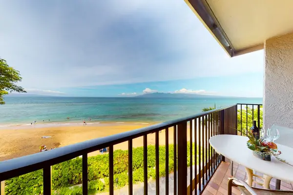 Private lanai with seating, perfect for enjoying the ocean breeze.