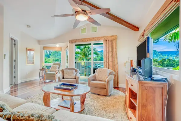 Living room with lots of natural light streaming in from the numerous windows.