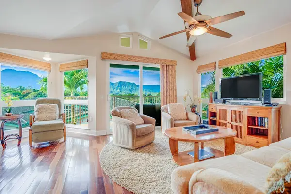 Spacious living room with plenty of seating and natural light.  There is a flat screen tv and a comfortable sofa bed for extra guests.