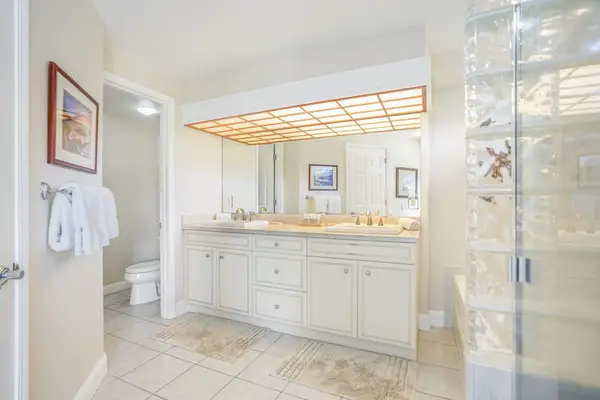 Large ensuite master bathroom with double sinks, garden tub and a walk in shower.
