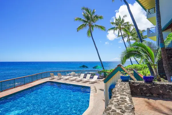 Lounge by the pool with cool island breezes