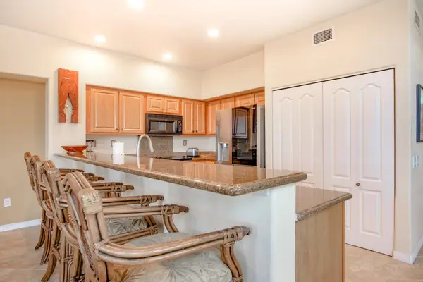 Fully Equipped Kitchen with Breakfast Bar & High-Backed Stool Seating