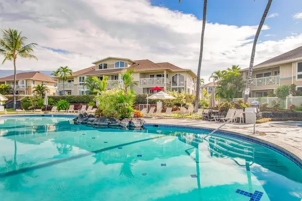 Resort-Style Pool Area with Expansive Sun Deck & Property View