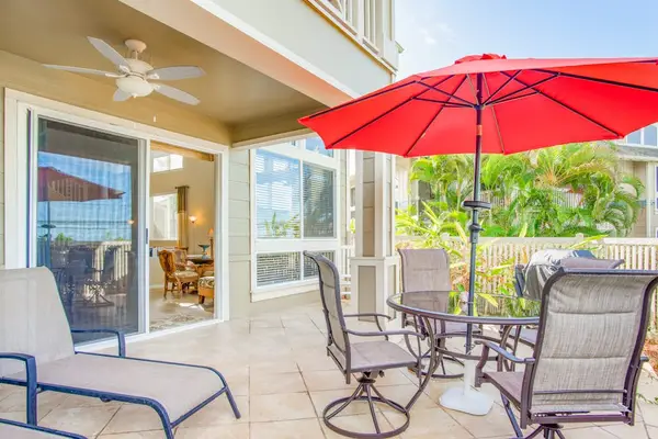 Private Covered Patio with Outdoor Dining Table & Sun Umbrella