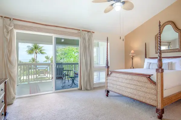 Spacious Primary Bedroom with Four-Poster Bed & Direct Balcony Access