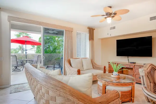 Sunlit Living Room with Wall-Mounted TV & Direct Patio Access