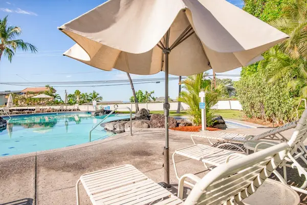 Poolside Sun Deck with Lounge Chairs & Patio Umbrella