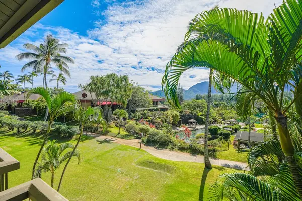 Admire lush tropical gardens and swaying palms from the balcony
