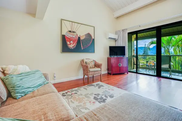 Bright living space offers comfortable seating and refreshing outdoor access