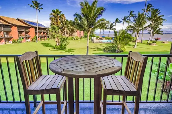 Furnished balcony providing comfortable outdoor seating for relaxing island moments every day