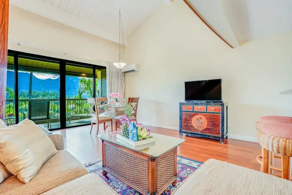 Comfortable living room features mountain views, warm furnishings, and television