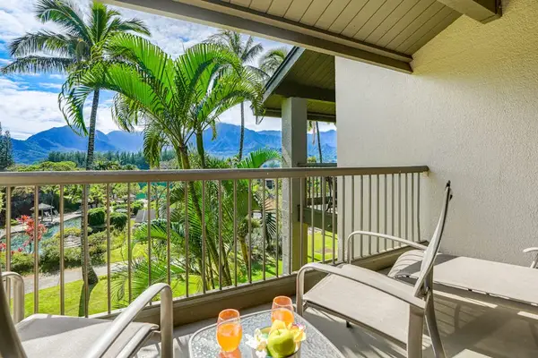Covered balcony provides seating, mountain views, and refreshing tropical scenery