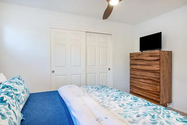 Spacious Primary Bedroom With Smart TV