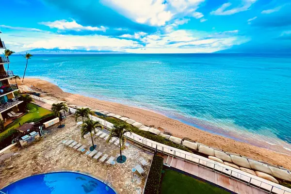 Hololani Resort Pool so close to the beach you can hear the waves crash ashore.