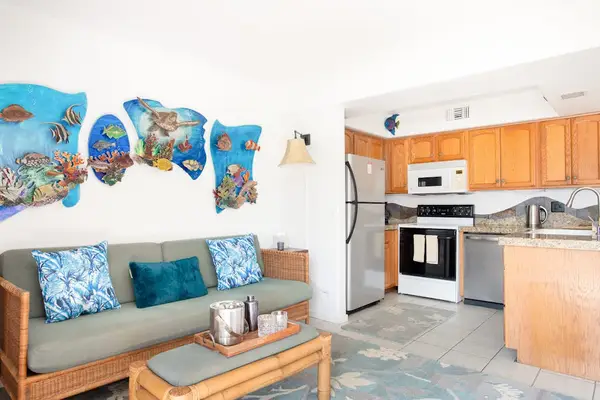 Open-Concept Living & Kitchen Area with Coastal Decor & Comfortable Seating
