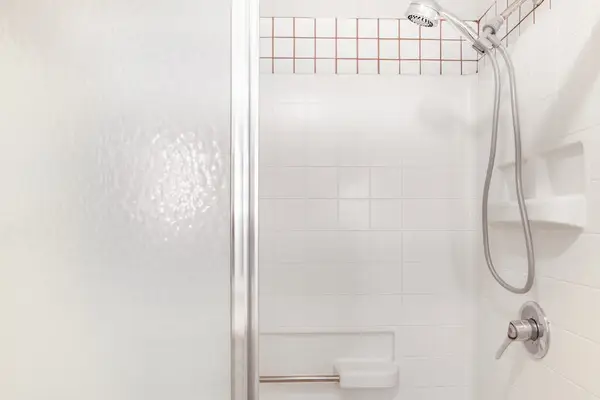 Clean Walk-In Shower / Tub Enclosure with Modern Fixtures