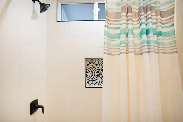 Guest bathroom with tub/shower combo.