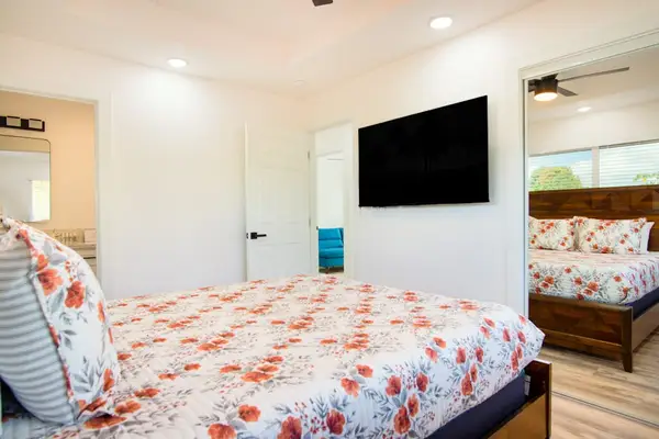 Master bedroom with queen bed and flat screen tv.