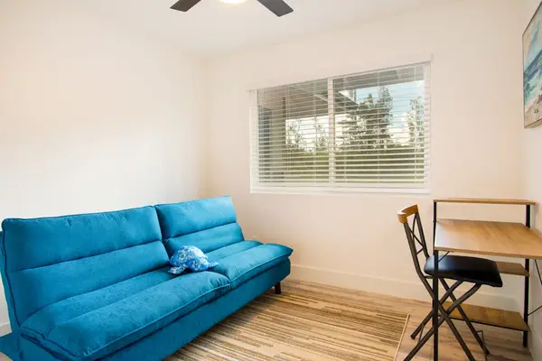 Guest room with double bed and a desk for any work to get completed.