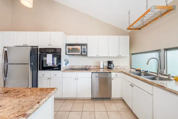 Kitchen with built-in microwave and granite counters
