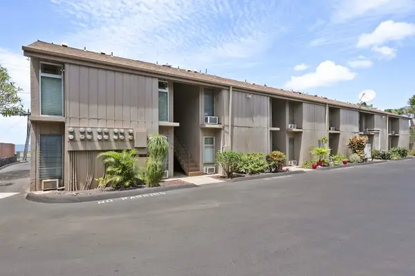 Building exterior surrounded by tropical landscaping