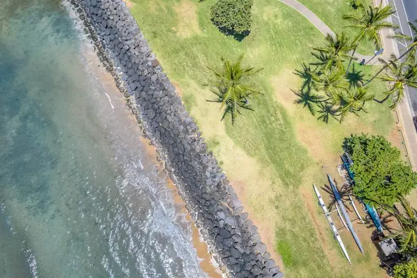 Aerial view of the rocky shoreline and green grounds