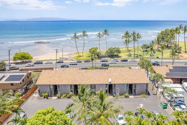 Aerial view of the oceanfront property and parking area