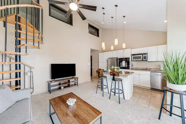 Vaulted living area with warm wood accents
