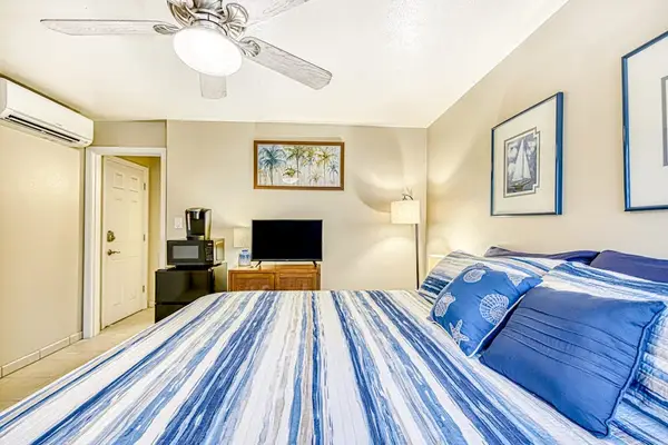 Guest room with king bed and a flat screen tv for your entertainment.