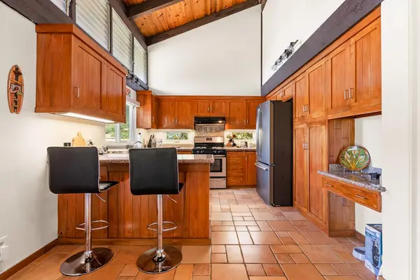 Full Kitchen with appliances and room for meal preparation