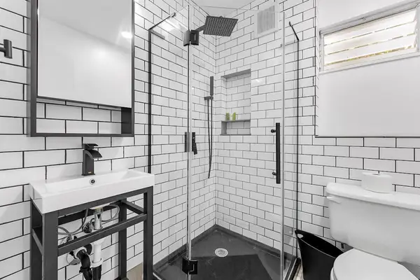 Bathroom with soaking tub and calming neutral design