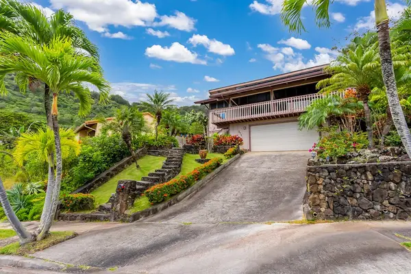Tropical exterior entrance surrounded by greenery