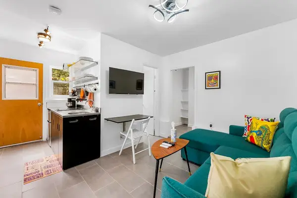 Open studio room connected directly to kitchen