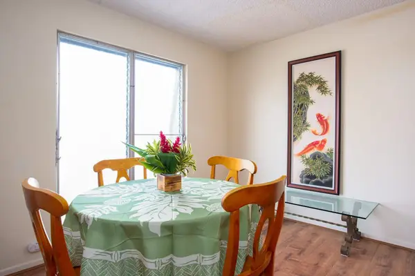 Dining room with seating for four with lots of natural light.