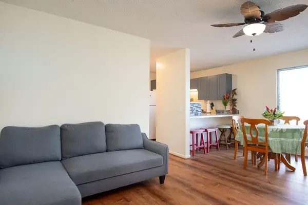 Living room with a sleeper sofa and a flat screen tv.