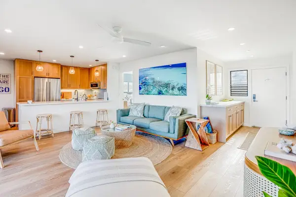 Modern Open Living Space with Light Wood Flooring & Contemporary Furnishings