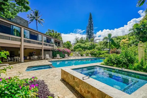 Sunlit Poolside Deck featuring Outdoor Hot Tub, Lounge Seating & Clubhouse Access