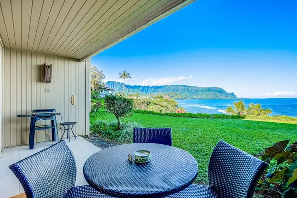 Covered Oceanfront Patio with Woven Dining Set & Electric Grill