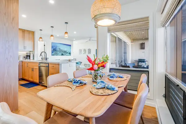 Elegant Dining Space Flowing into the Open Kitchen & Patio Entrance